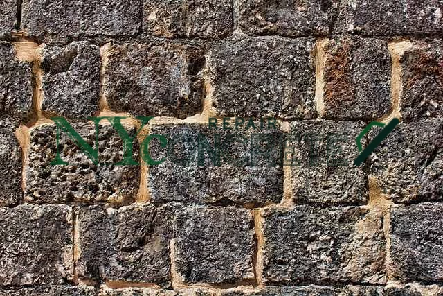 failed mortar joints and water damage in an nyc stone wall