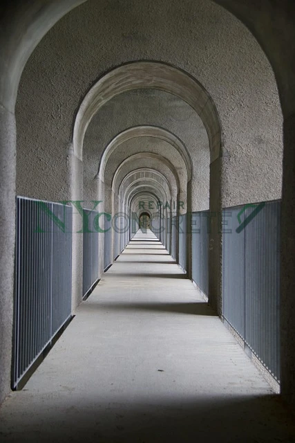 cracked and uneven concrete walkway in need of repair